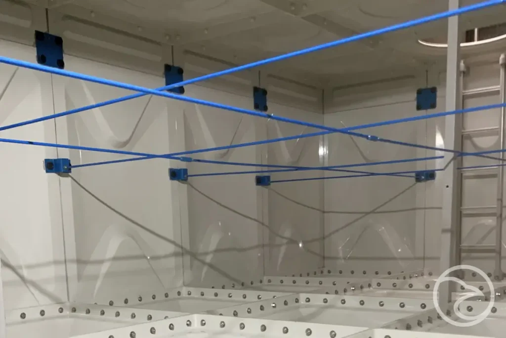 Large fiberglass water storage structure at facility