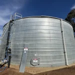 Large industrial water storage tank showing material aging effects