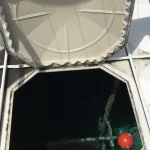 Fibreglass water tank surface showing signs of material ageing