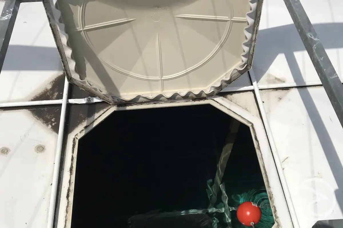 Fibreglass water tank surface showing signs of material ageing