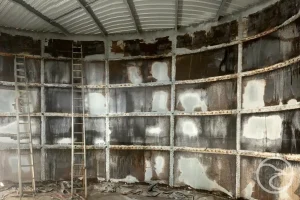 Rust and pitting on steel industrial tank surface