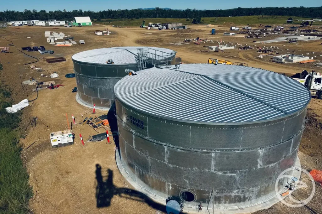 Technician checking corrosion on a steel storage tank