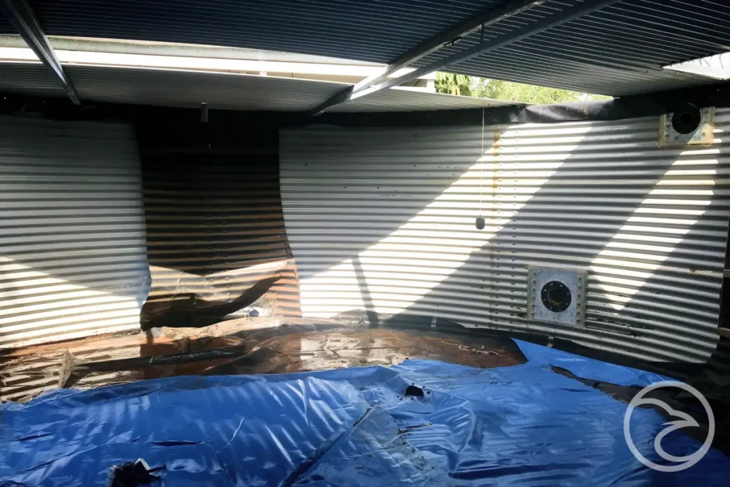 Cracked tank liner inside a steel water storage