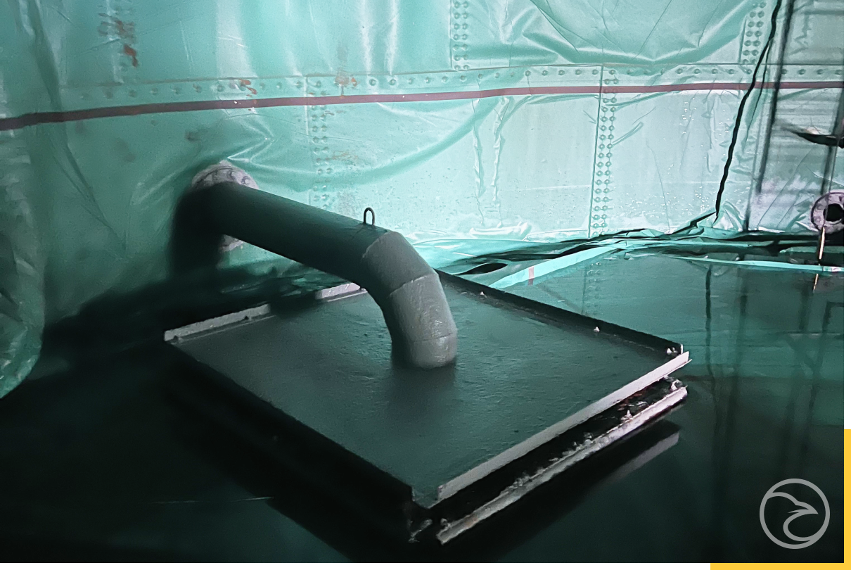 technician performing industrial tank inspection