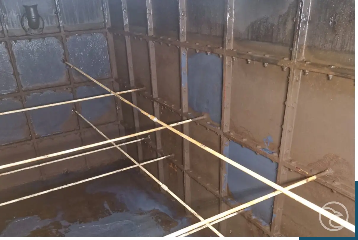 Corroded industrial tank before repair work